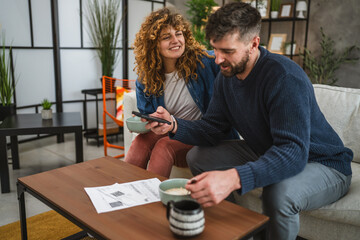 couple eat oatmeal and making a contactless payment using smart phone