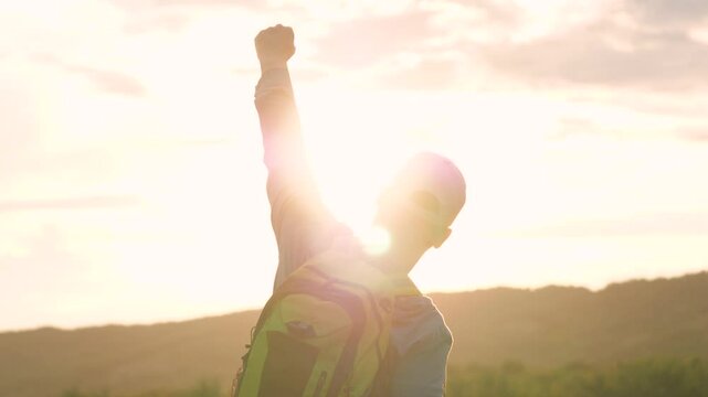 man with backpack background sunset mountains, climber traveler mountains, man resting nature, conquer peaks, tourist male rest, hiking weekend summer mountains sunset, hand up victory, winner peaks