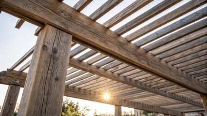 A medium closeup of a newly installed pergola structure with sunlight filtering through the slats highlighting the intricate wood grain and adding a rustic charm.