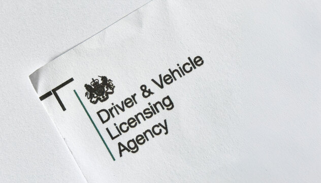 Newcastle-under-Lyme, Staffordshire-united kingdom October, 20, 2023  The logo for the Driving and Vehicle Licensing Agency on the corner of a leaflet