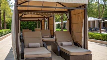 Fototapeta premium Medium closeup of a shaded seating area with canopies showcasing comfortable lounge chairs designed to protect users from the elements while waiting.