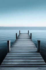 A peaceful wooden dock extends over tranquil waters, evoking calmness and contemplation.