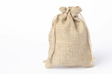 One beige burlap bag on white background