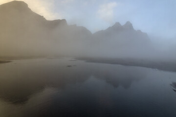 Scenic Vestrahorn mountain landscape by water in breathtaking Stokksnes in Iceland