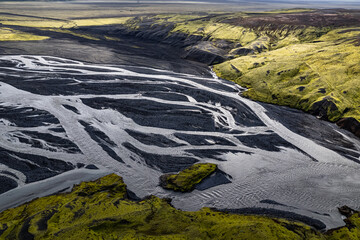 Aerial drone view exploring a river valley landscape with a amazing glacial basin very close to...