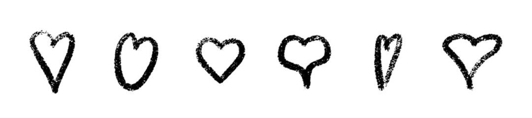 Crayon heart set of black sketched shapes with rough textured edges - grunge hand drawn love symbols in different sizes. Romantic decorative elements for valentine design.