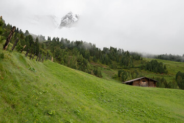 Rustic Wooden Cabin in the Misty Austrian Alps