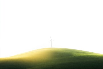 Obraz premium A single wind turbine stands atop a gently rolling green hill under a bright white sky, symbolizing clean energy.