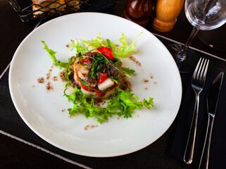 Codfish timbale with fried red peppers, arugula and olive oil