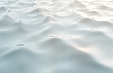 Obraz premium Abstract rippled water surface. Light waves create smooth patterns. Calm water texture. Clear turquoise water surface with soft light reflections. No people. Ideal for backgrounds or abstract designs.