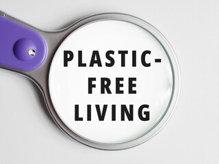 Plastic-Free Living text through magnifying glass background