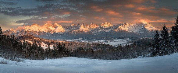 Majestic Alpine Sunrise: A Panoramic Winter Wonderland