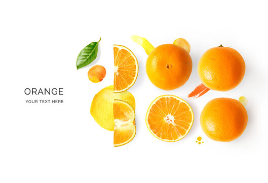 Creative layout made of orange and watercolor spots on the background. Flat lay. Food concept. Lemon on white background.