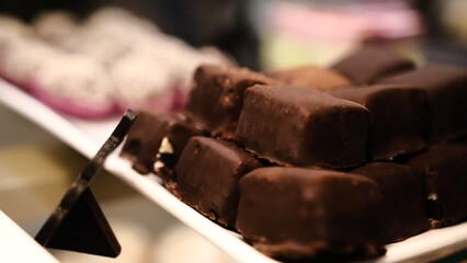 beautiful chocolate truffles on a white plate tempting handmade chocolates on display luxury confections rich chocolate treats delicious sweets gourmet indulgence mouthwatering chocolate