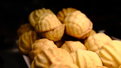 Delicious classic large cookies filled with sweet condensed milk, close-up of traditional homemade dessert on a plate, perfect for holiday treats, rich flavor, soft texture, popular sweet snack
