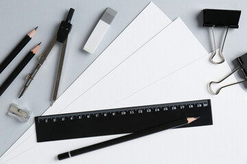 Flat lay composition with ruler and other stationery on light grey background