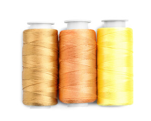 Spools of bright sewing threads isolated on white, top view