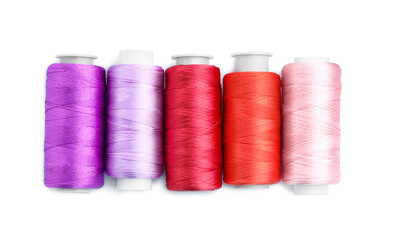 Spools of bright sewing threads isolated on white, top view