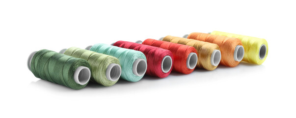 Spools of bright sewing threads isolated on white