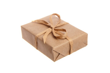 Small rectangular gift wrapped in biodegradable kraft paper and tied with a natural fiber bow. An eco-friendly and plastic-free packaging option on a white background