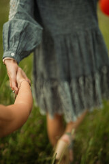 mom and daughter holding hands