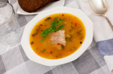 Traditional Russian soup rassolnik with beef meat. Russian cuisine