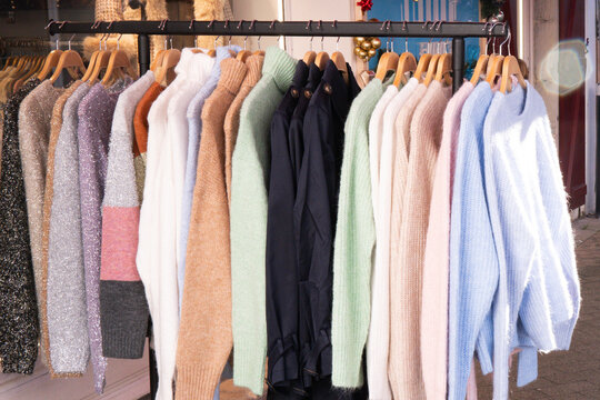 Cozy wool and knit sweaters on display in clothing store