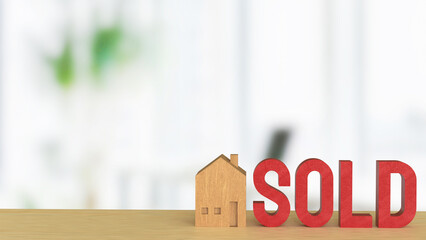 The Toy wood house and red sold text for Property or real estate concept 3d Rendering..