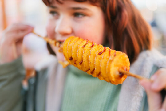 Tasty Spiral Tornado Potatoes Savored at Outdoor Market