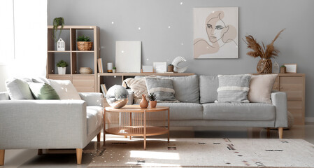 Interior of modern living room with grey sofas and disco ball on coffee table