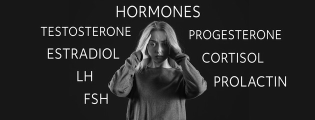 Depressed young woman on dark background