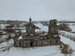 Old abandoned wooden ruined Russian trinity church in Plan, Ulyanovsk region, aerial view