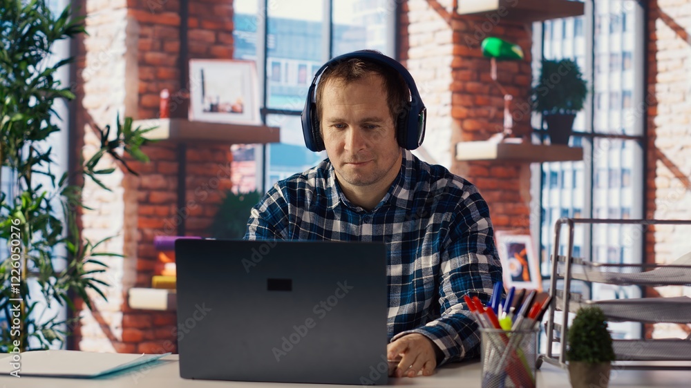 Poster teleworker enjoying music while researching data for company project, doing tasks in personal home o