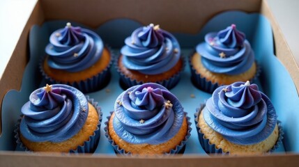 Six Delicious Blue Cupcakes in a Box Ready for a Special Occasion