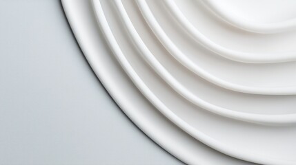 Obraz premium Elegant White Plates Arranged in Layered Pattern on Soft Background