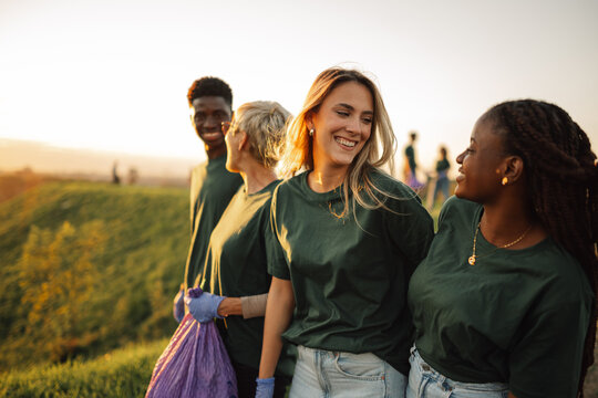 Group of volunteers collecting garbage together