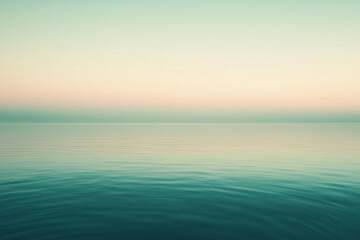 Fototapeta premium Serene sunset over calm waters, reflecting soft pastel hues, creating a tranquil atmosphere