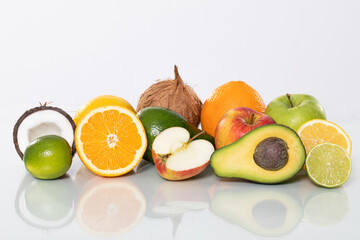 A Fresh Assortment of Colorful and Diverse Fruits Displayed on a Glossy Surface with Shine