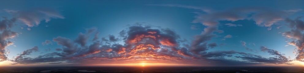 Sunrise panorama with stratocumulus clouds. Colorful sky with sun setting. Aerial view shows landscape below. Dramatic cloudscape. Perfect for 3D graphics, game environments. Use as sky replacement