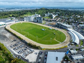 Aerial view of Alexandra Park, a horse racing track, with parking lots and surrounding city....