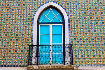 Typical colorful traditional architecture facade featuring Portuguese tiles azulejos in the old Alfama district of Lisbon