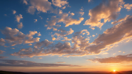 Obraz premium Golden clouds at sunset over flat land, are excellent for travel brochures, inspirational quotes, and nature-themed designs needing a dreamy background