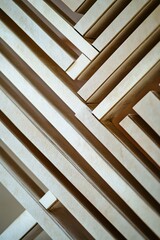 Obraz premium Abstract geometric pattern created by wooden planks, with a modern aesthetic for background design