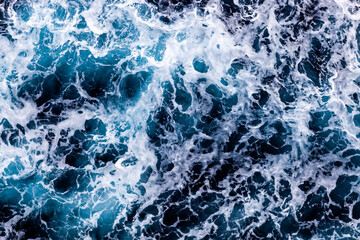 Sea surface background. Top view of classy foamy water. Can be used in covers, packaging, posters, textures, presentations, art, and design projects. Awesome nature background image.