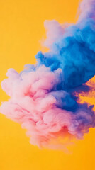 Fototapeta premium Colorful clouds of pink and blue smoke on vibrant yellow background