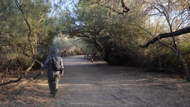 Man vapes and litters throwing electronic waste on the ground.