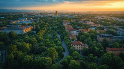 Fototapeta premium Aerial View of Wroclaw Cityscape at Dusk with Lush Greenery and Urban Architecture