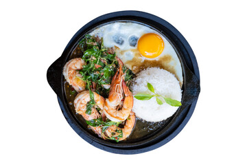 A sizzling hot plate of Thai basil shrimp stir-fry served with steamed rice and a fried egg isolate...