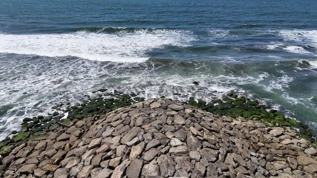 Aerial View of the breakwater from above at Kemiren Beach, Cilacap