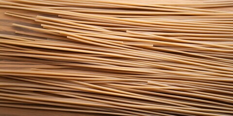 Long strands of uncooked pasta, top view background. 